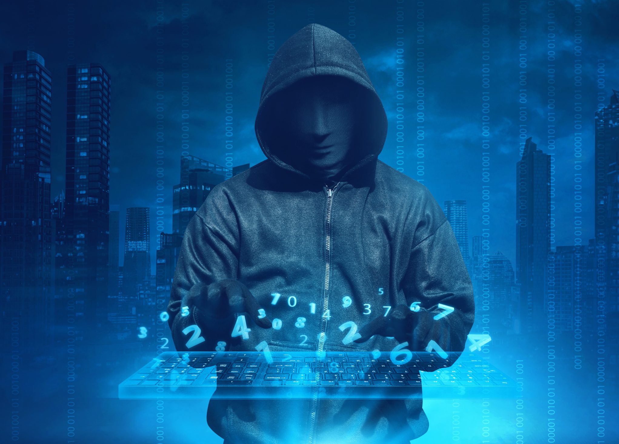 Hooded hacker typing on holographic keyboard