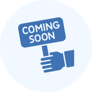 Hand holding "Coming Soon" sign